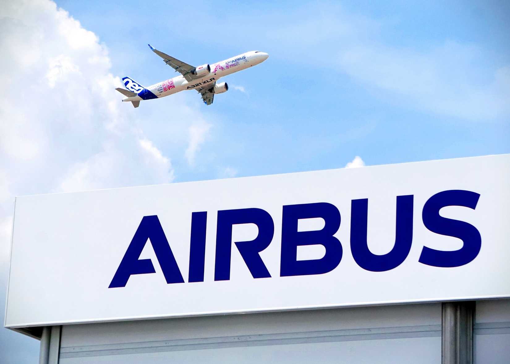 An Airbus A321XLR flight test aircraft flying above the Airbus chalet 