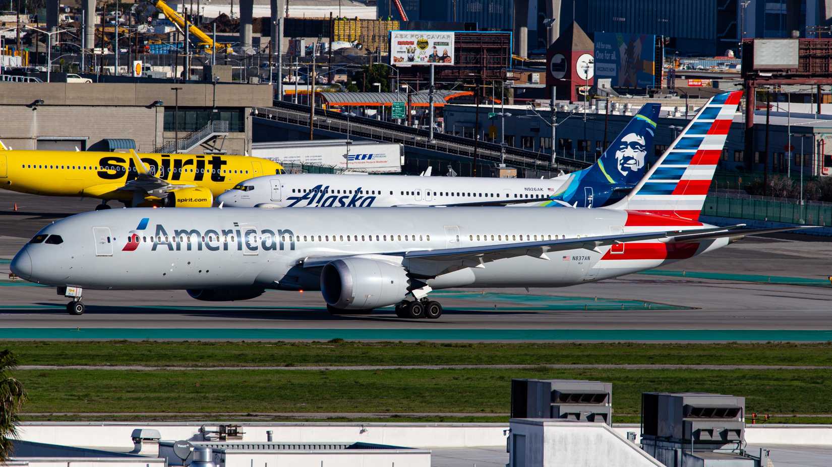 Photo of an American Airlines passenger plane (Boeing 787-9 Dreamliner | N837AN) at Los Angeles International Airport with Spirit Airlines and Alaska Airlines plane