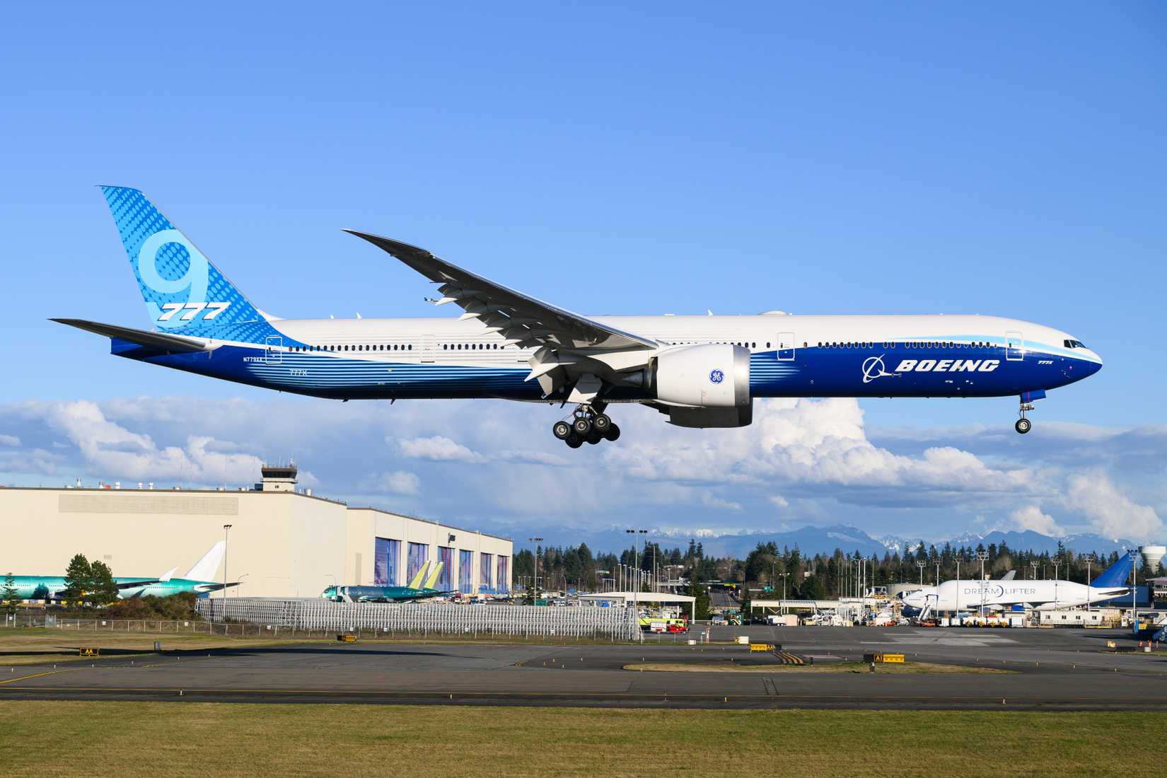 Boeing 777-9 prototype of 777X aircraft wheels down landing at KPAE as N779XX in company colors with factory