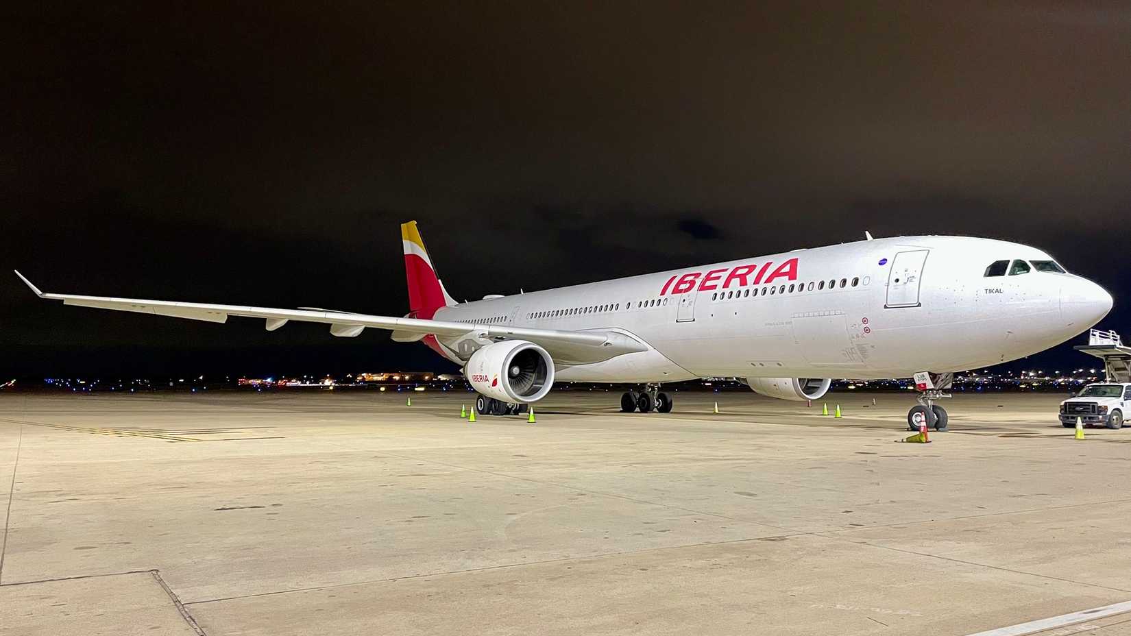 An Iberia Airbus A330-300 parked at a gate area at MAD airport 