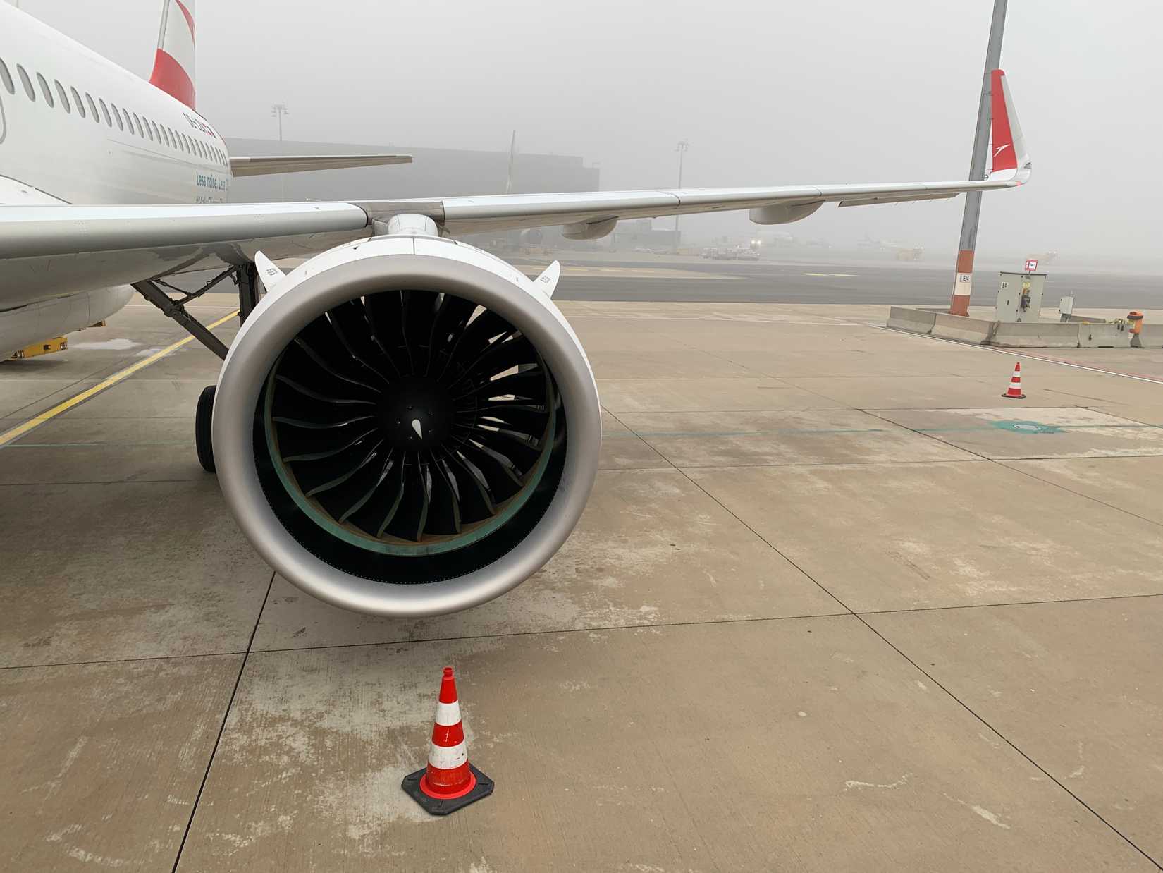 Wing section of Austrian Airlines Airbus A320neo with winglets and modern Pratt and Whitney PW1000G geared turbofan engine