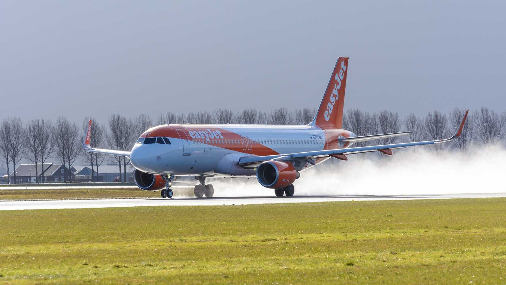 An easyJet Airbus A320-200 taking off from AMS airport 