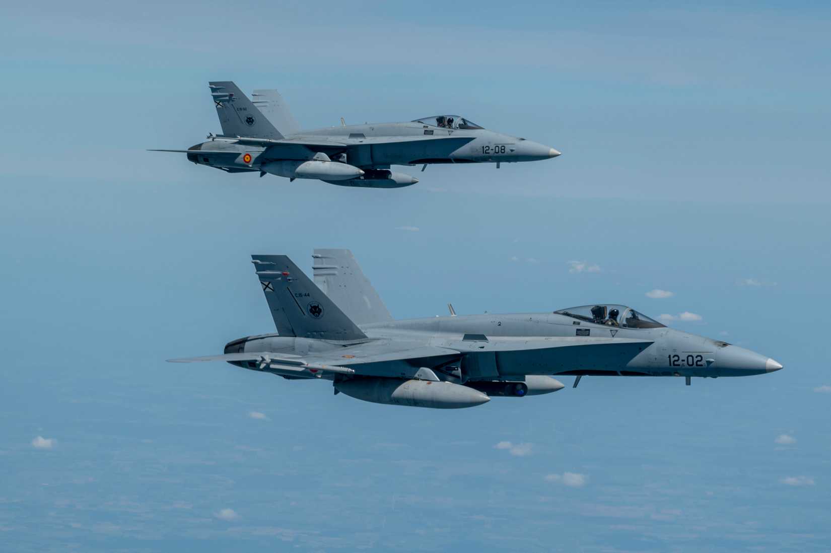 Spanish Air Force F-18 Hornets escort a U.S. Air Force B-52H Stratofortress.