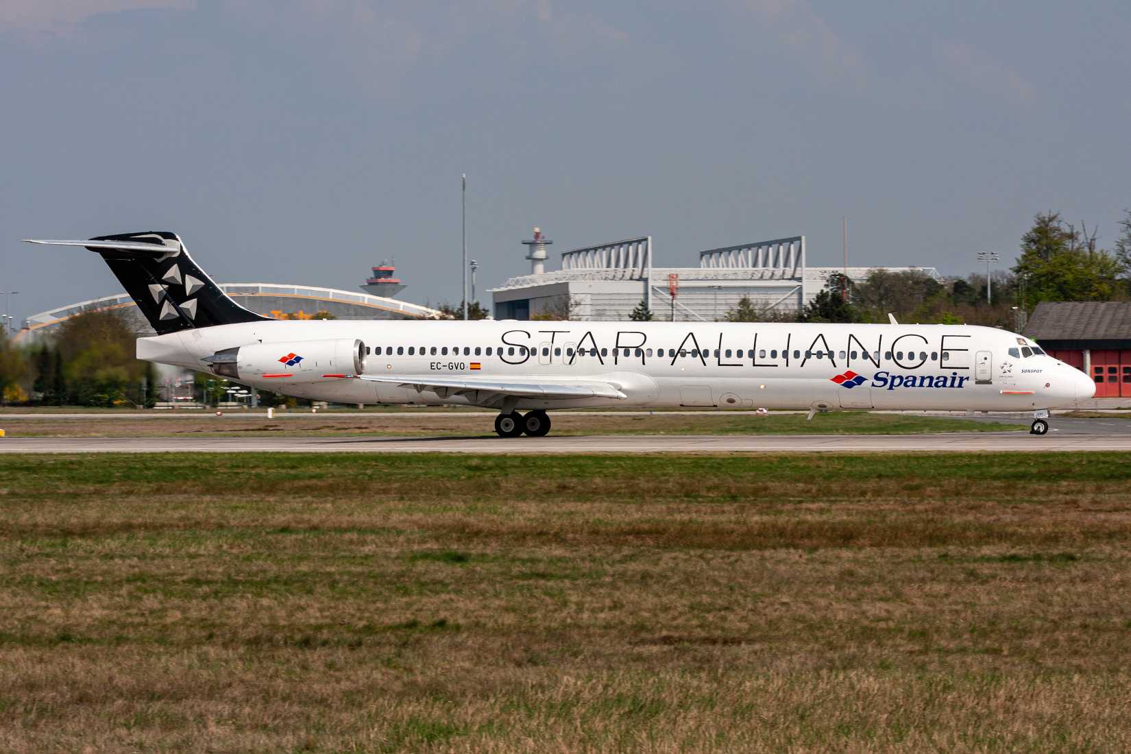 Spanish Spanair McDonnell Douglas MD-83 in Star Alliance livery with registration EC-GVO on take off roll on runway 18 of Frankfurt Airport.