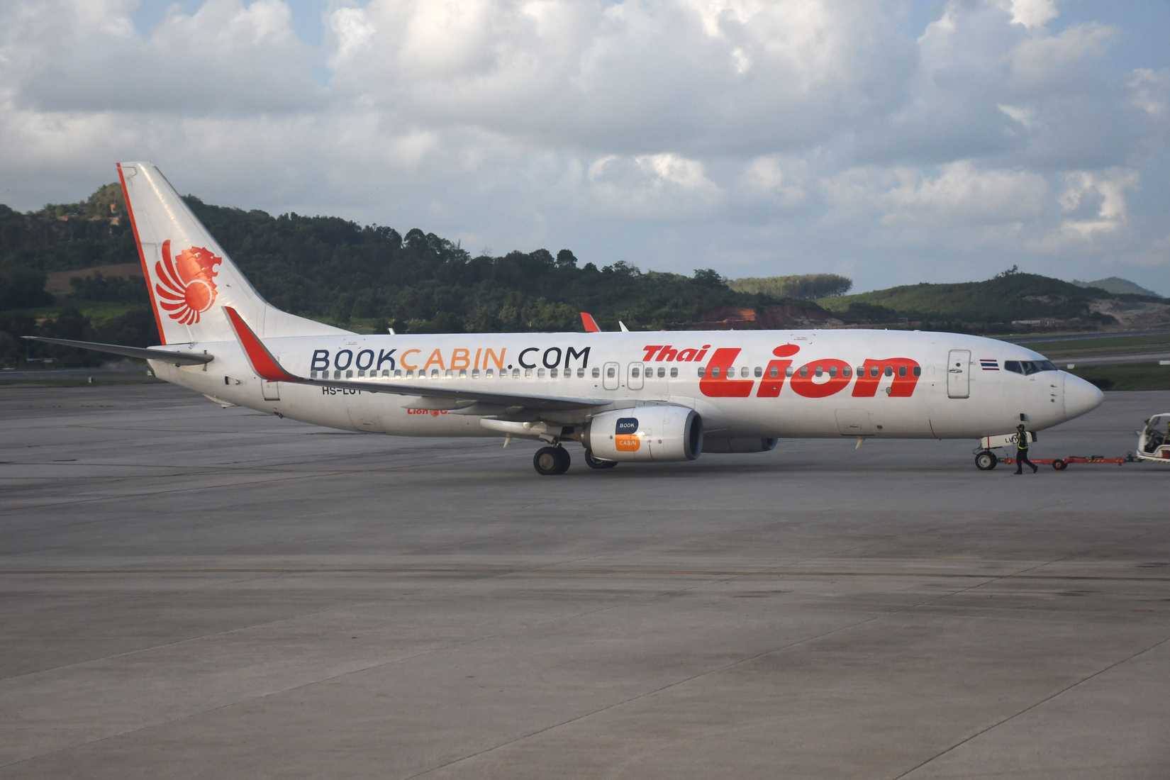 Thai Lion Air Boeing 737-800 parked at Phuket Airport runway.