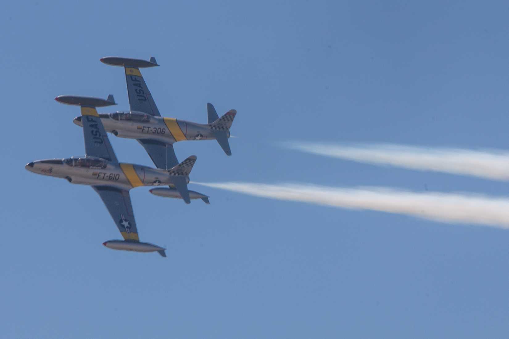 Two T-33 T-33 Shooting Stars perform a flyover and aerobatics during the 2024 Marine Corps Air Station Miramar Airshow in San Diego, Sept. 28, 2024.