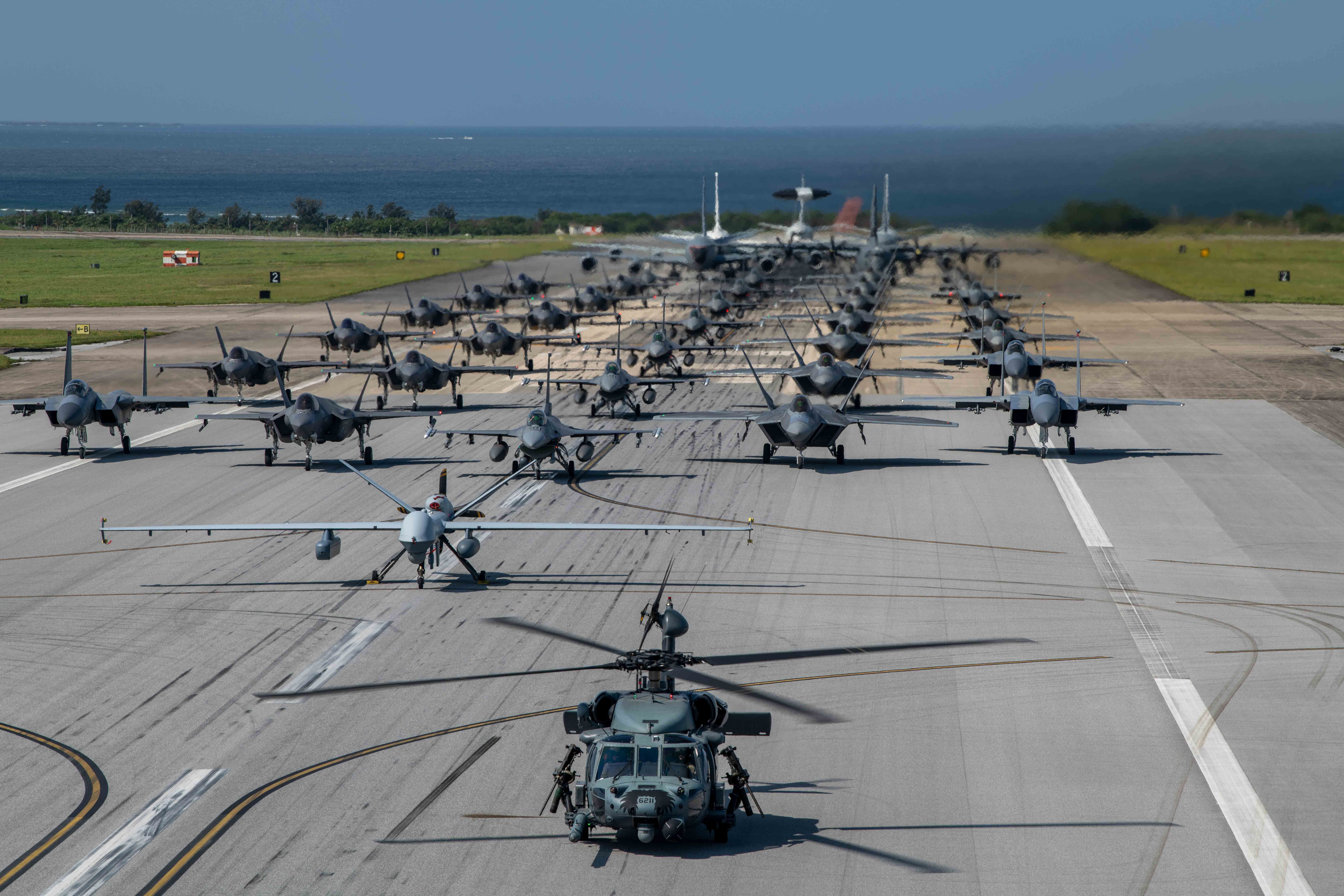 U.S. Air Force and Navy aircraft line up on the runway during an elephant walk at Kadena Air Base, Japan, Apr. 10, 2024.