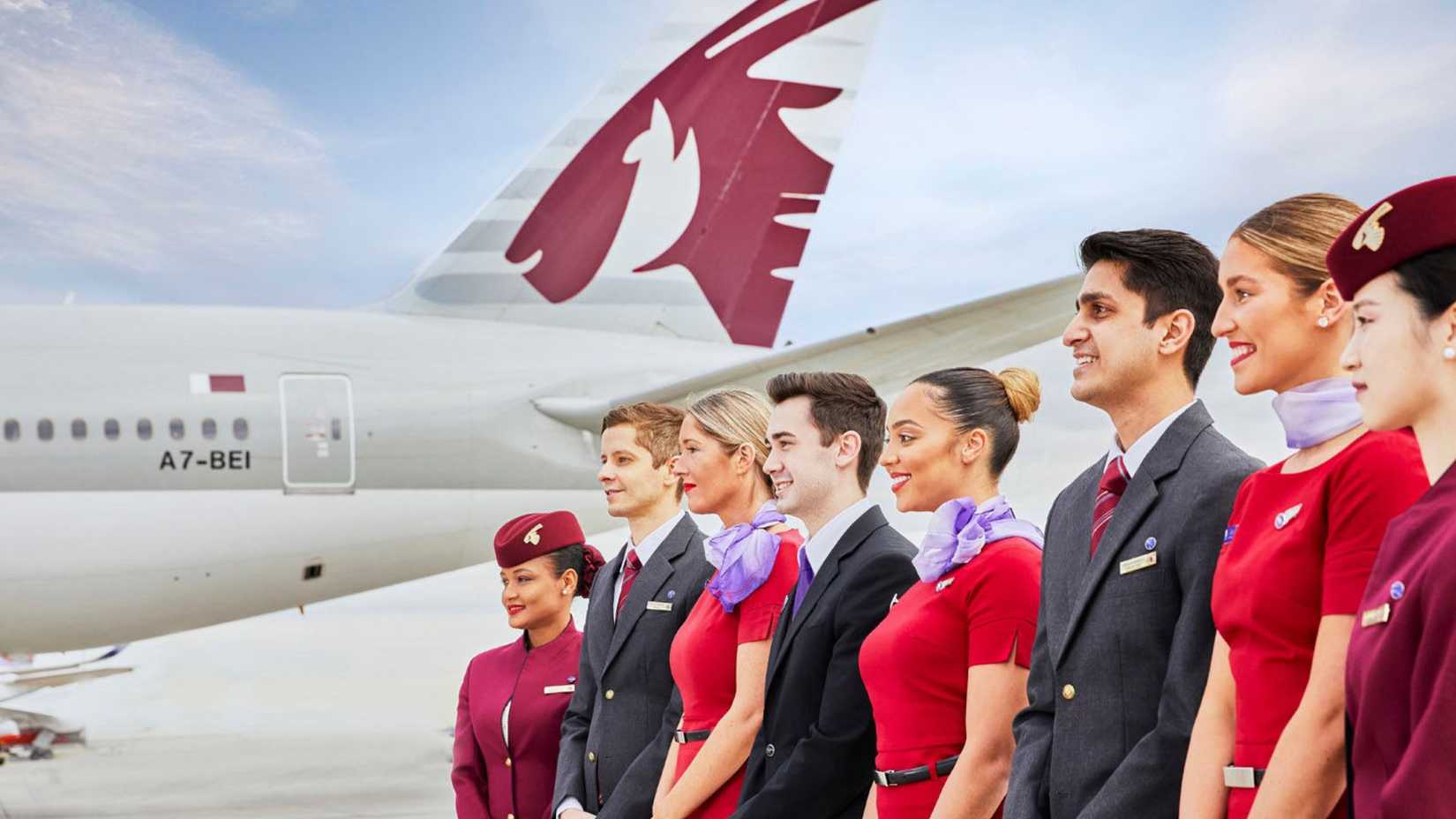 Virgin Australia and Qatar Airways Flight Attendants standing side by side.