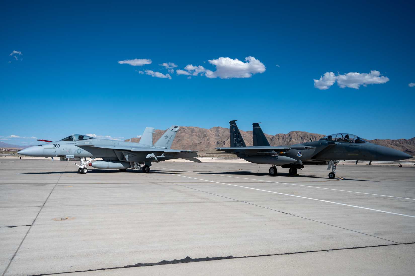 US Navy FA-18 Super Hornet parked beside a F-15EX Eagle II