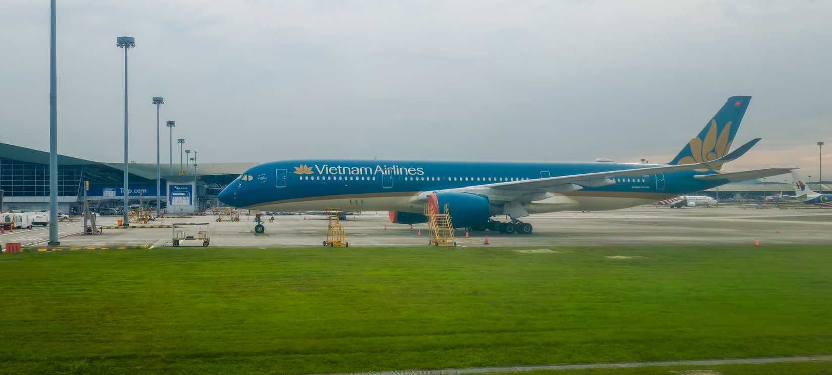 Vietnam Airlines Airbus A350-900 aircraft on the tarmac at an airport.
