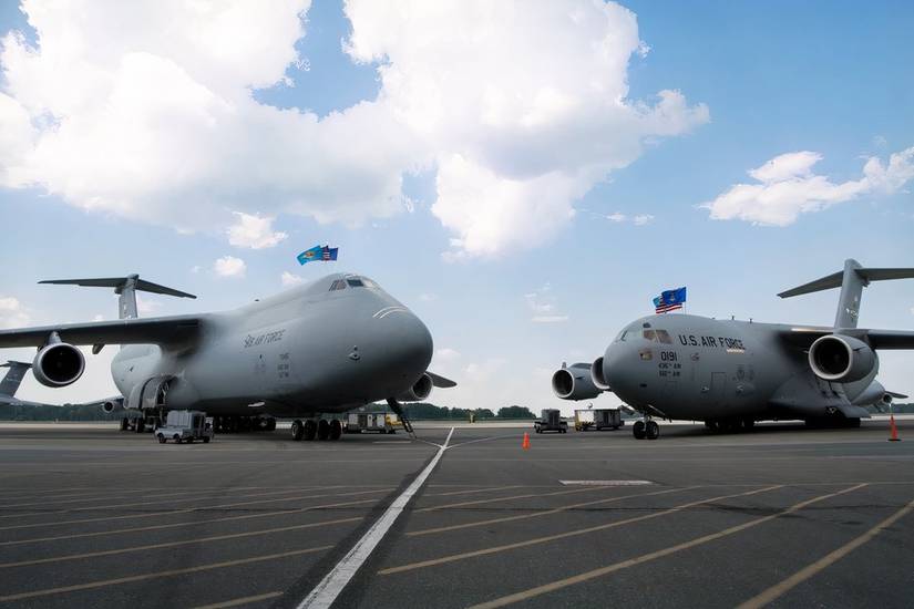 A C-5M Super Galaxy and C-17 Globemaster III sits on the flight line during the 436th Operations Group change of command July 29, 2019, at Dover Air Force Base, DE.
