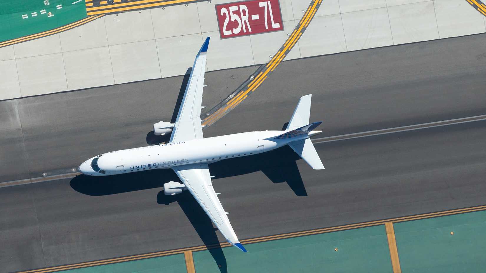 Aerial view of United Express Embraer 175 at Los Angeles International Airport (LAX).