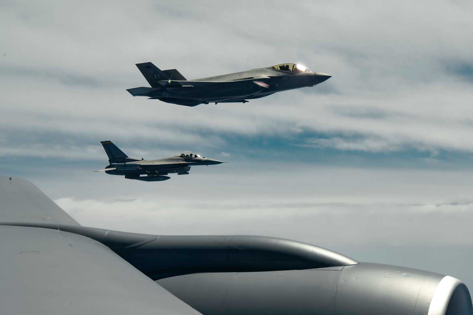 Air Force F-16 and F-35, fly in formation off the wing of a KC-135 during Checkered Flag, May 14, 2024.