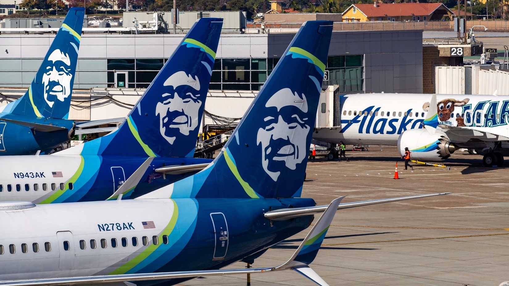 Alaska Airlines Boeing 737s on the ground awaiting their next flights