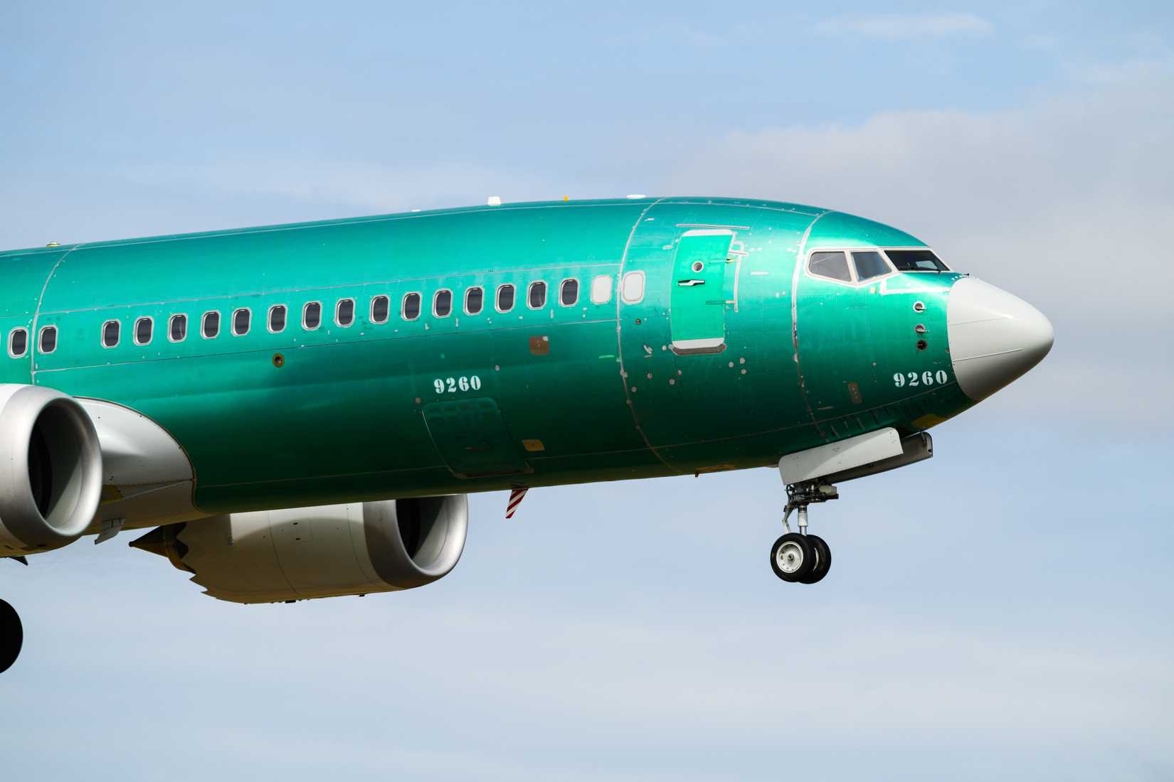 Boeing 737 Max 8 on first test flight in pre delivery green coating closeup of nose