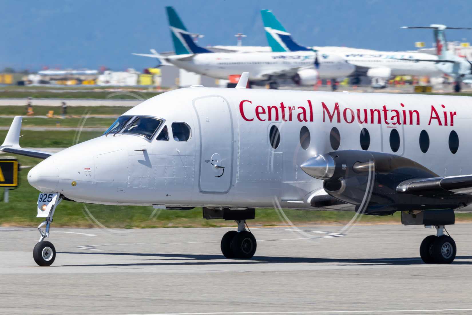 Central Mountain Air Beechcraft 1900 taxiing to the terminal at Vancouver Intl. Airport.