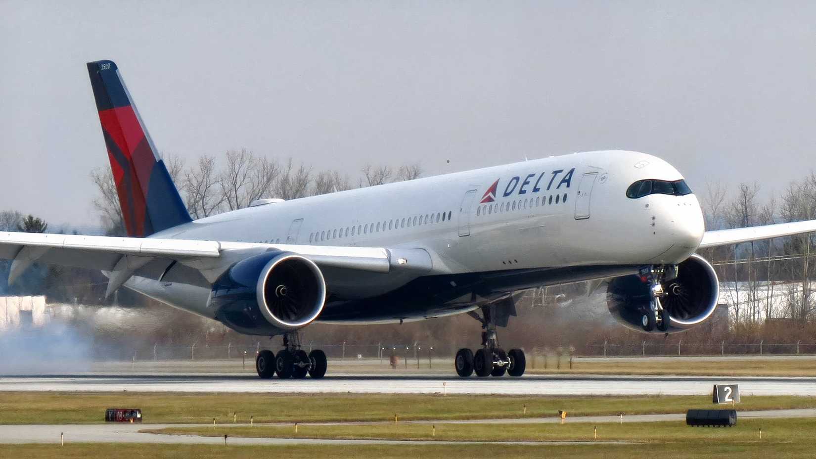Delta Air Lines Airbus A350-900 touching down with smoke