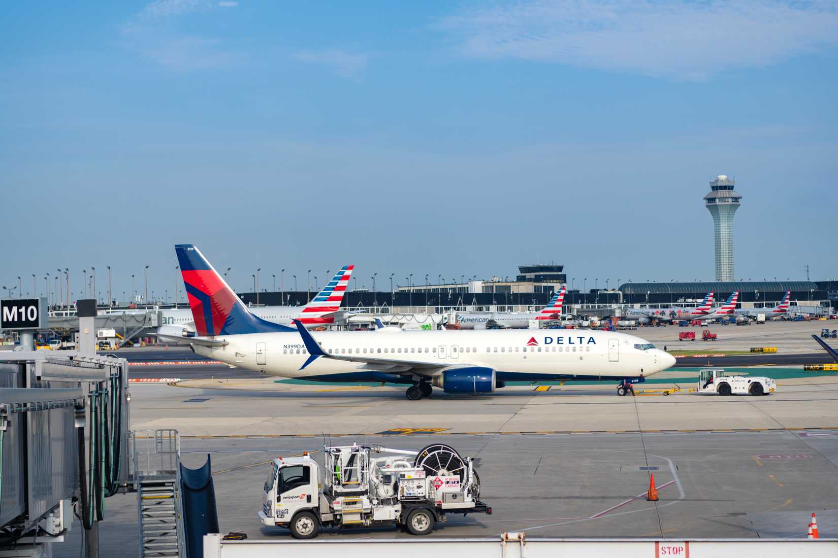 Delta Air Lines departure and arrival at airport terminal.