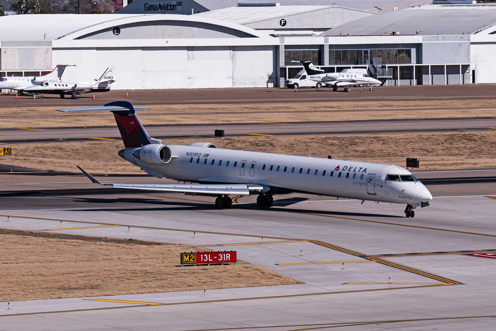 Delta Connection Bombardier CRJ900 N301PQ 13L arrival at Dallas Love Field Airport.