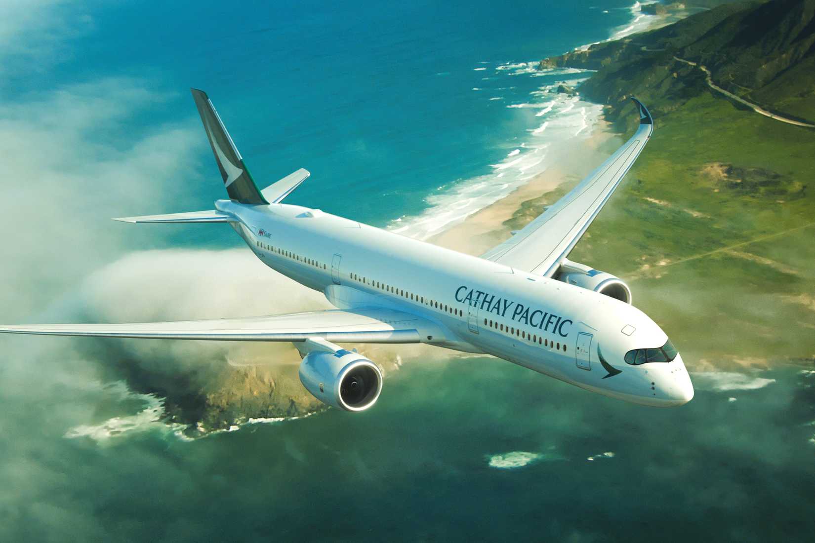 Cathay Pacific Airbus A350 flying over a beach