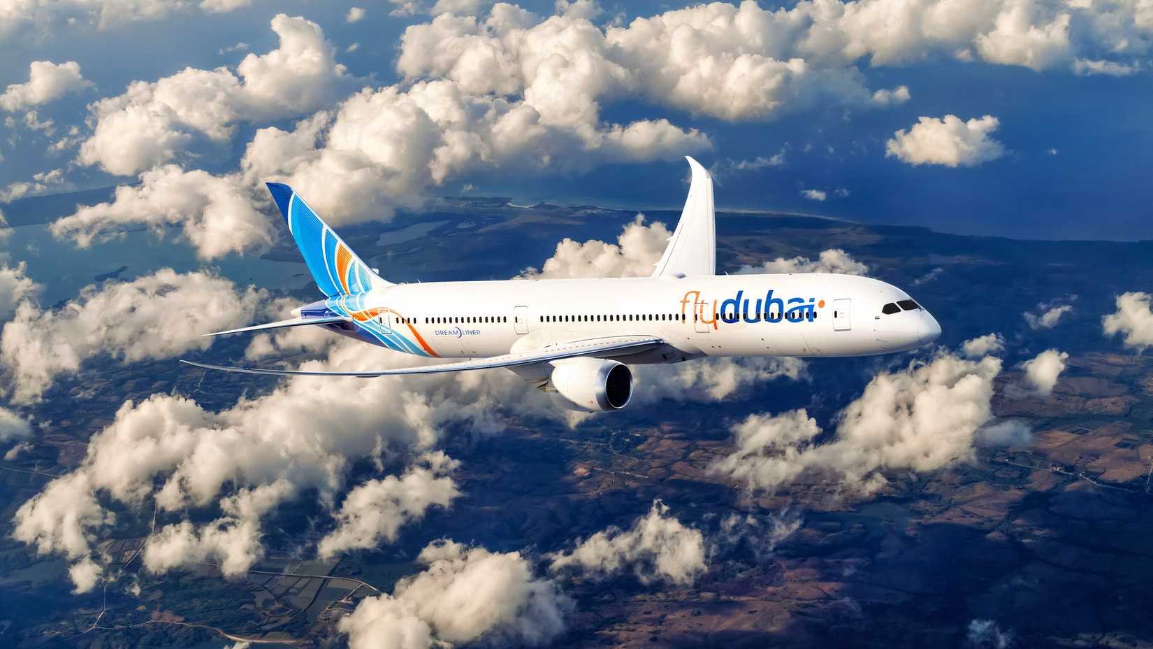 A CGI image of a flydubai Boeing 787-9 flying above the clouds.