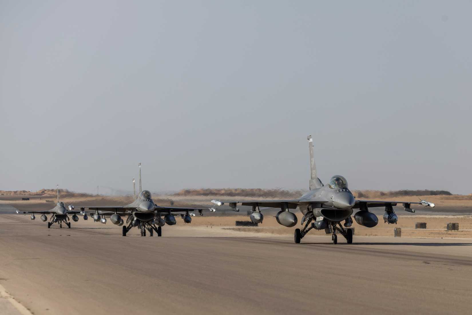 Four F-16C Fighting Falcons, assigned to the 55th Expeditionary Fighter Squadron, taxi at Cairo West Air Base, Egypt, Aug. 26, 2025.