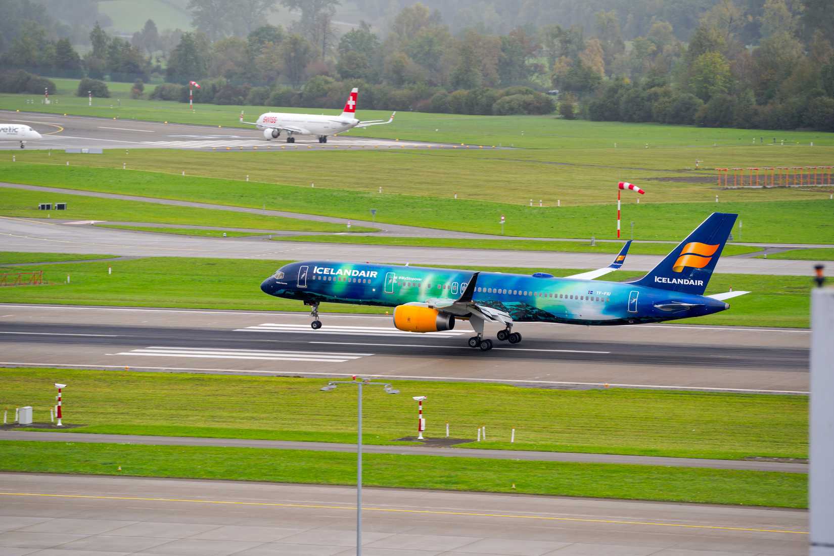 Icelandair airplane Aurora Borealis Livery Boeing 757-256 registration TF-FIU landing at Swiss Zurich Airport.