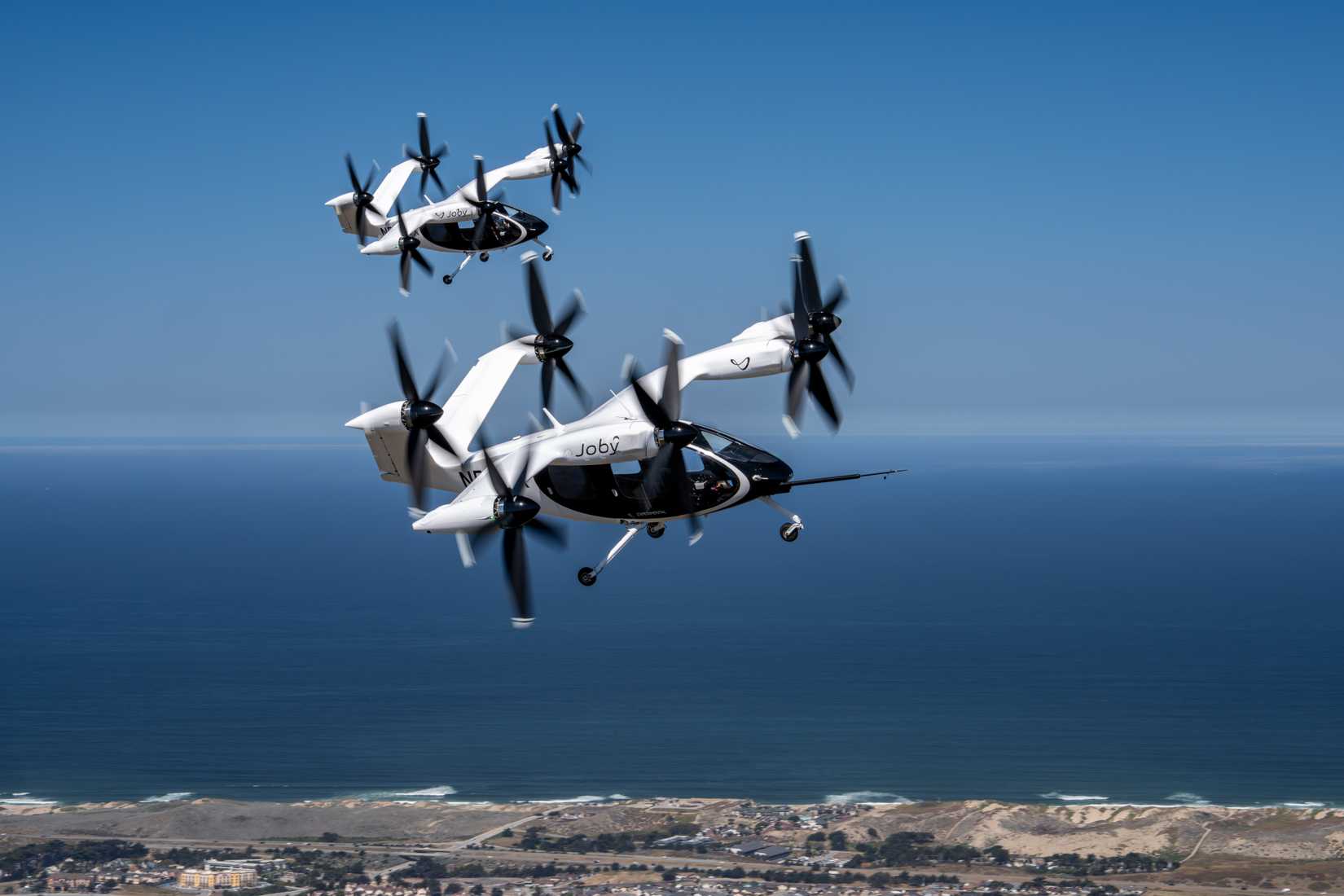 Two Joby Aviation S4 eVTOLs flying