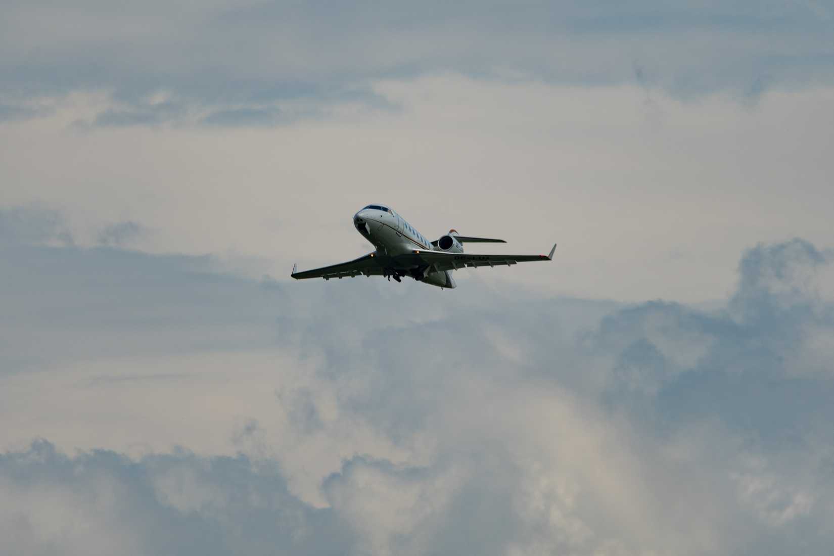 Premium Jet Bombardier Challenger 650 aircraft is taking off from runway 32
