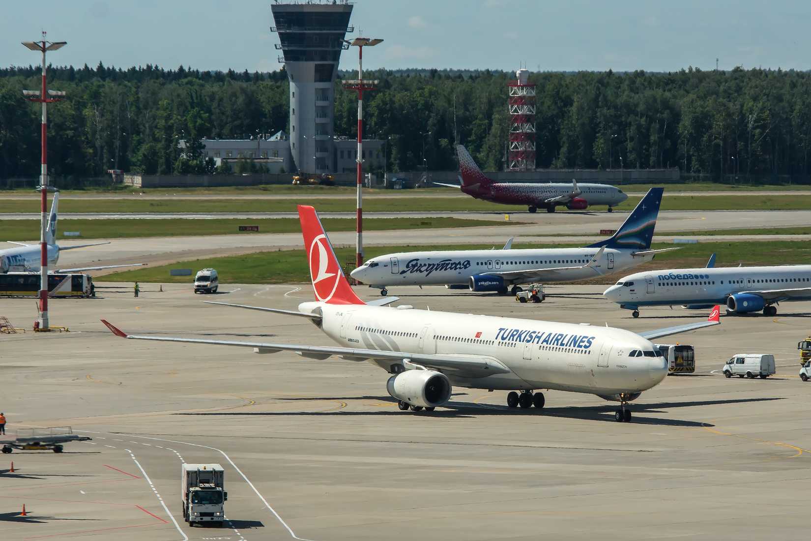 Modern twin engine civil airplane Airbus A330 Turkish airlines standing on parking place at ground maintenance at Vnukovo International airport.