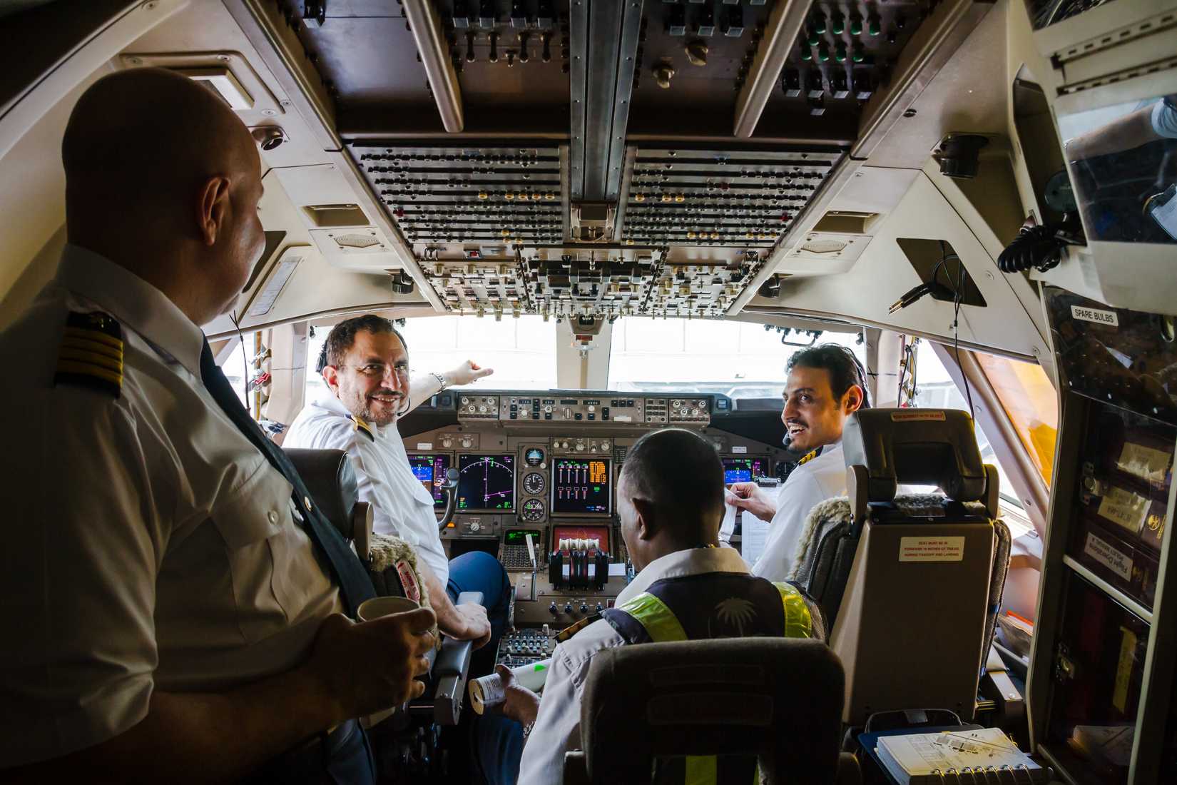  pilots prepare the plane Boening 747 to take off before a flight to Jeddah, Saudi Arabia. Cockpit with pilots of the flight.