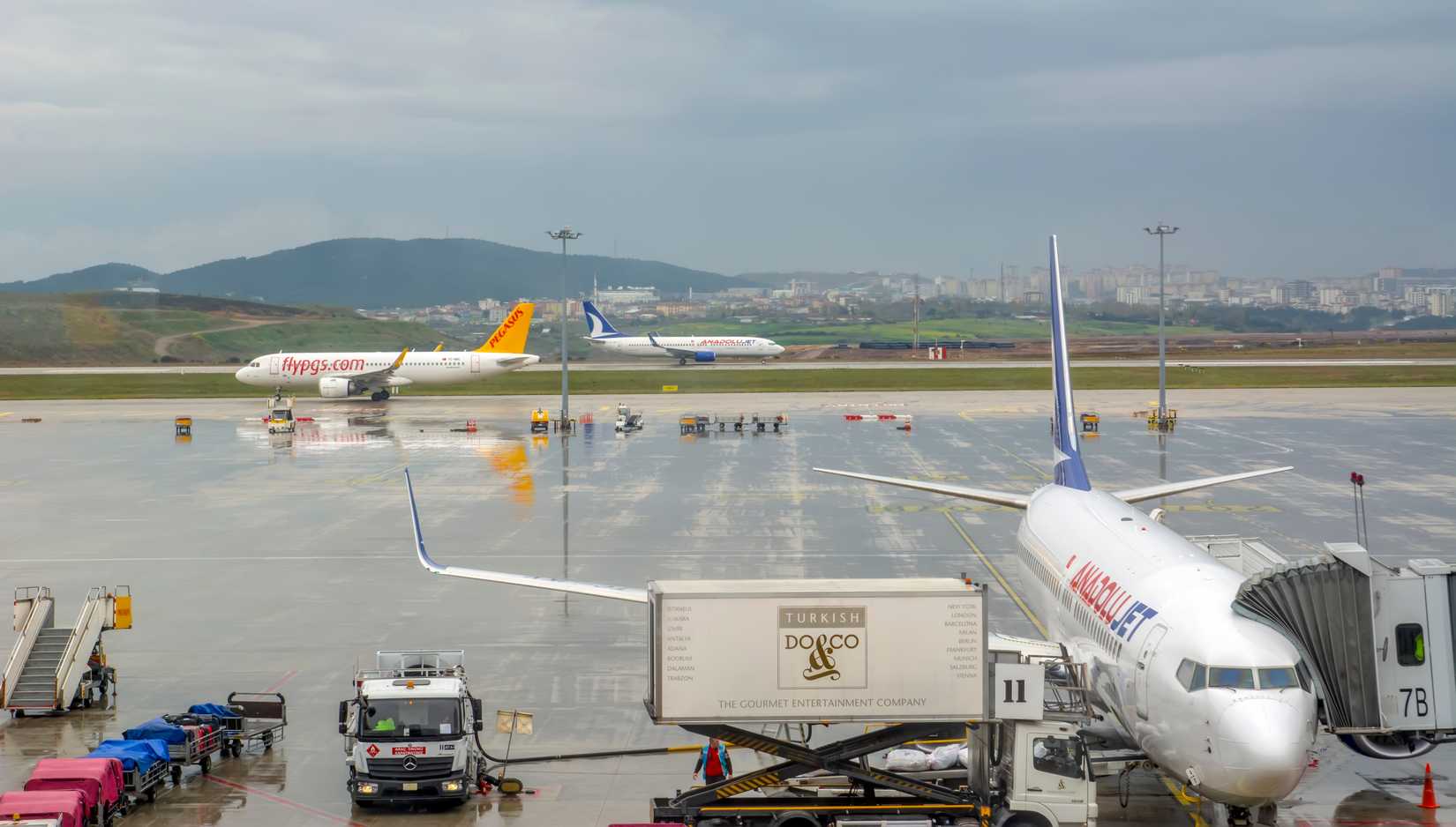 Airplanes waiting at the airport waiting for their flight. Sabiha Gokcen Airport. Airplanes belonging to Pegasus Airlines.