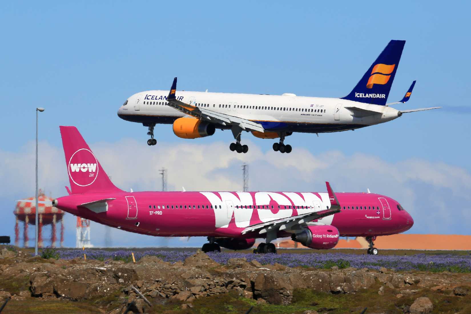 WOW Air Airbus A321 and Icelandair Boeing 757 airplanes at Keflavik airport (KEF) in Iceland.