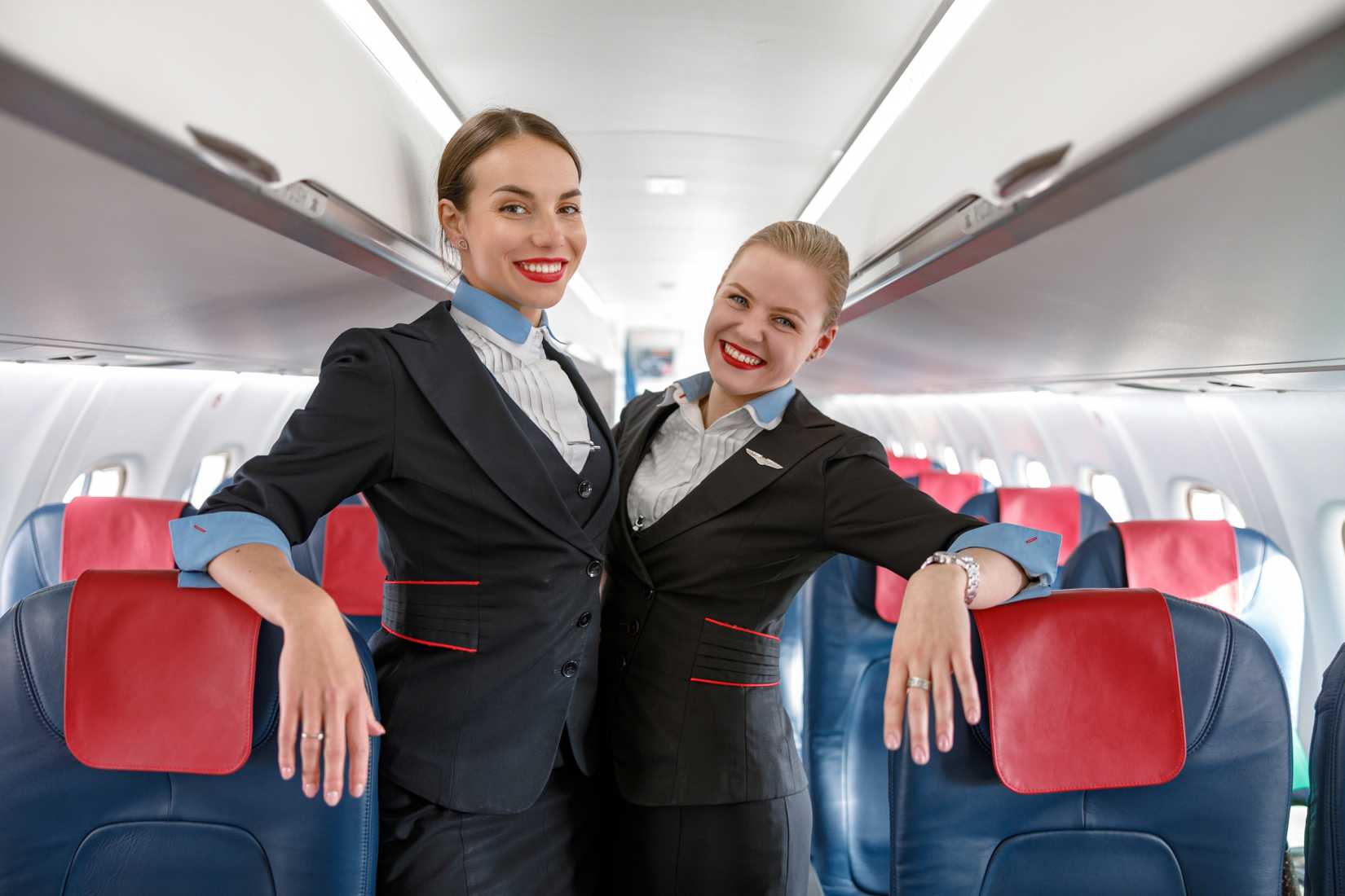 two flight attendants in aisle