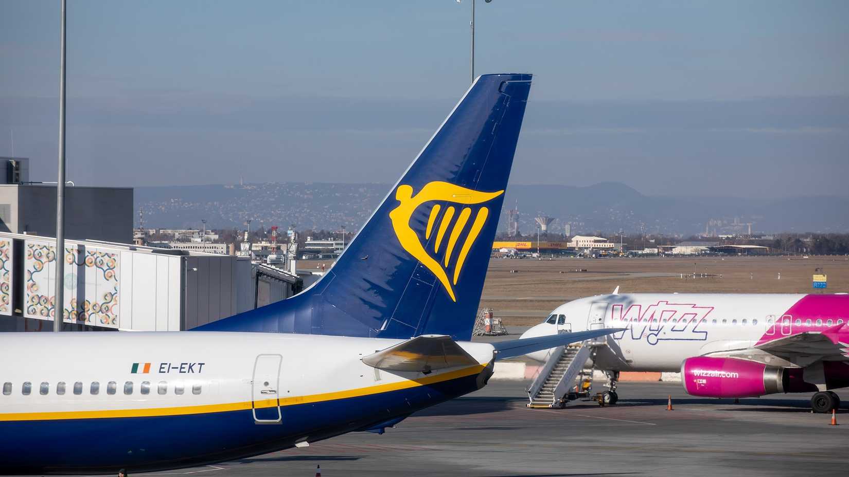 The tail of a Ryanair Boeing 737 and a Wizz Air A320 in the background