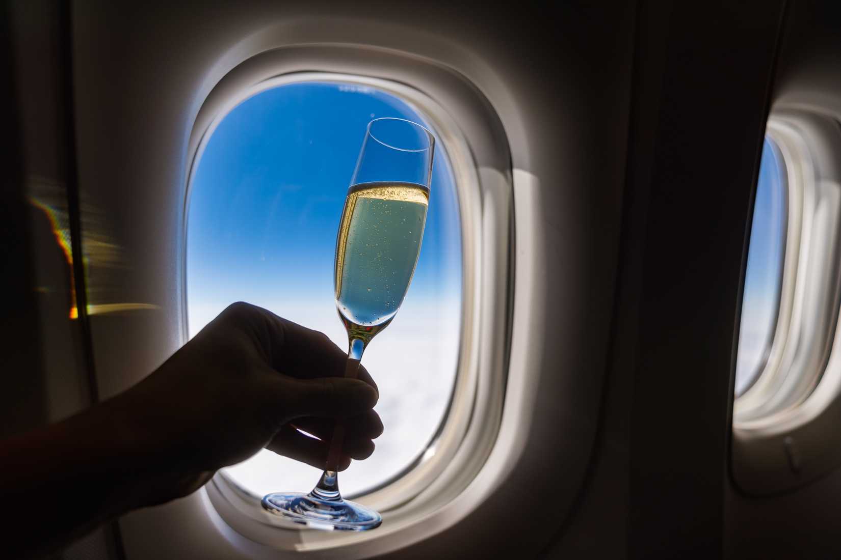 Champagne glass with window in international flight