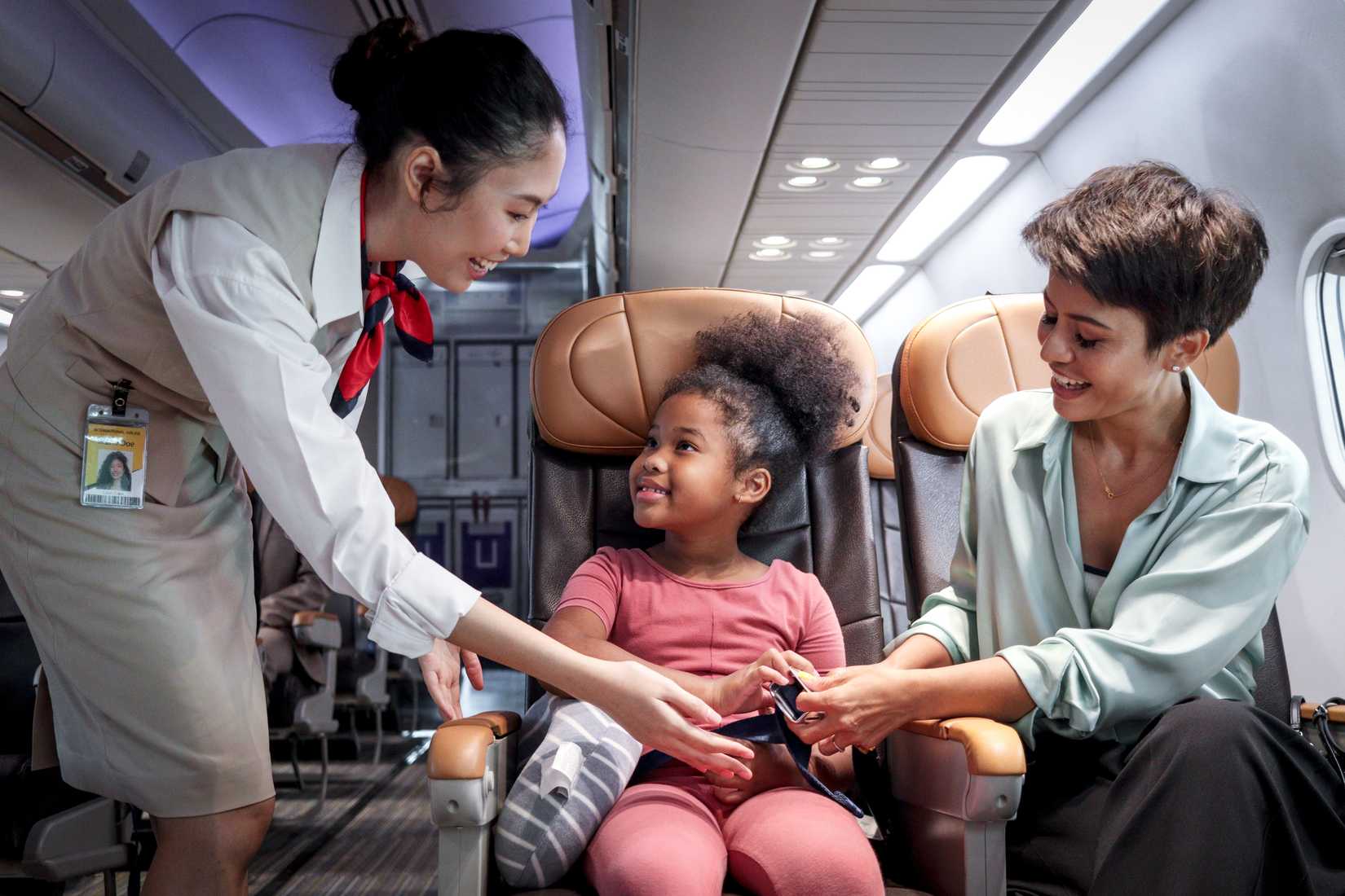 flight attendant looking after passenger with child