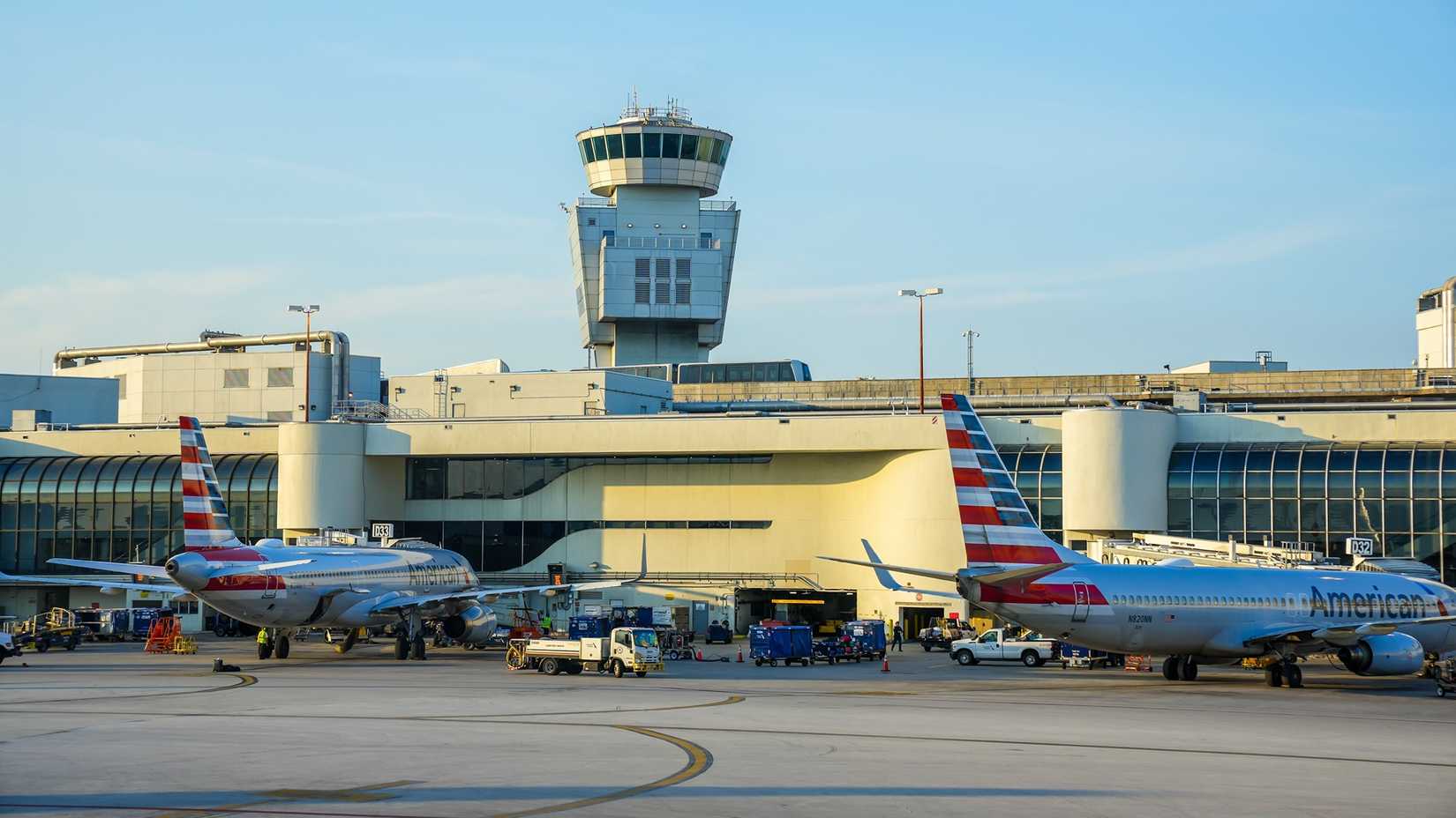 Two American Aircraft planes parked at gates at Miami International Airport