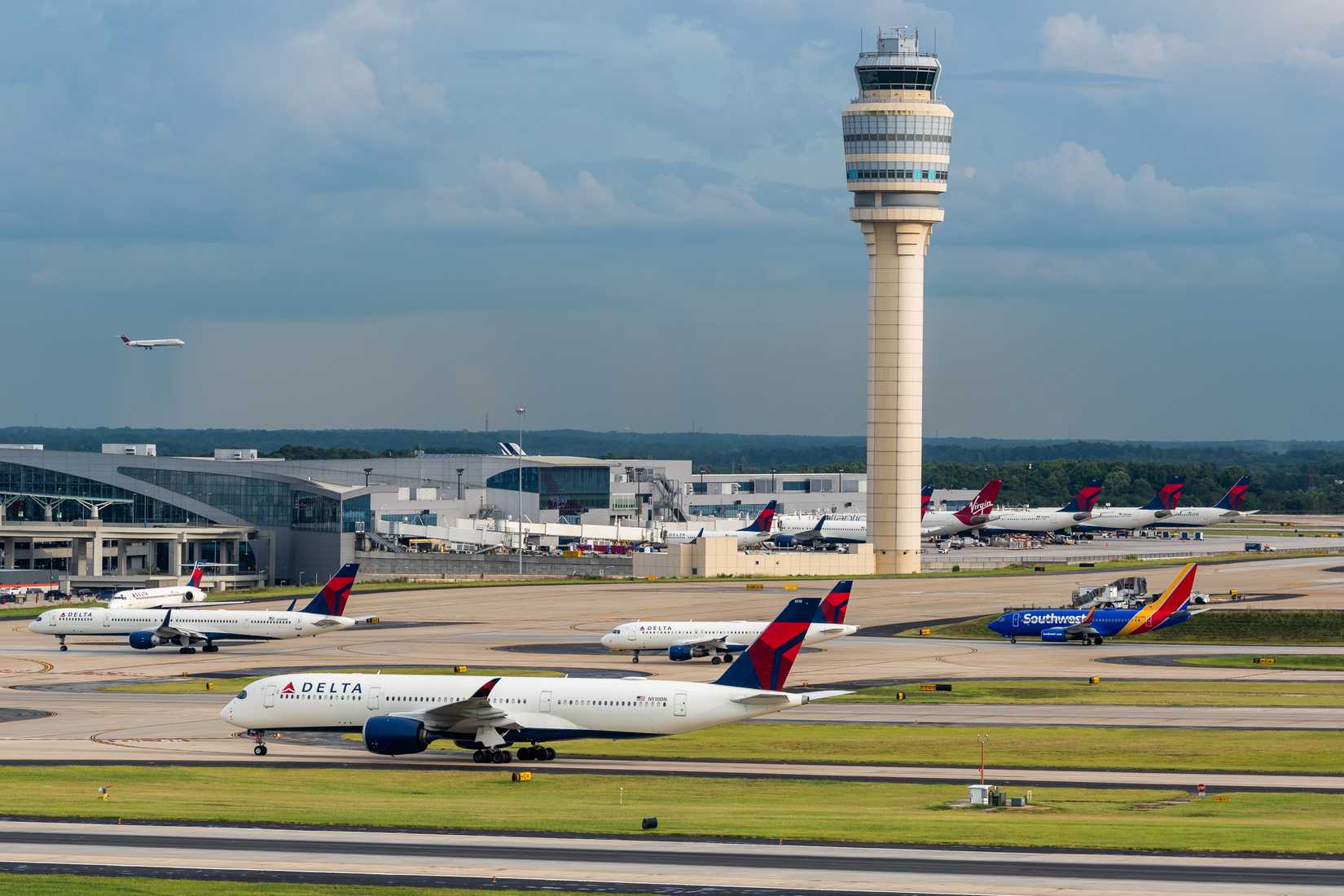 Hartsfield-Jackson Atlanta International Airport with aircraft and control tower