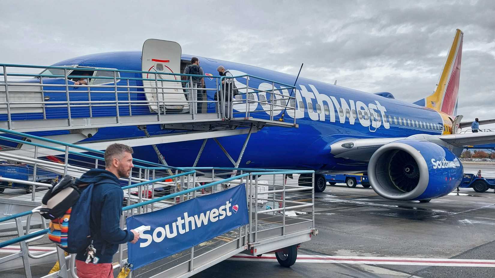 Passenger approaching Southwest Airlines jet