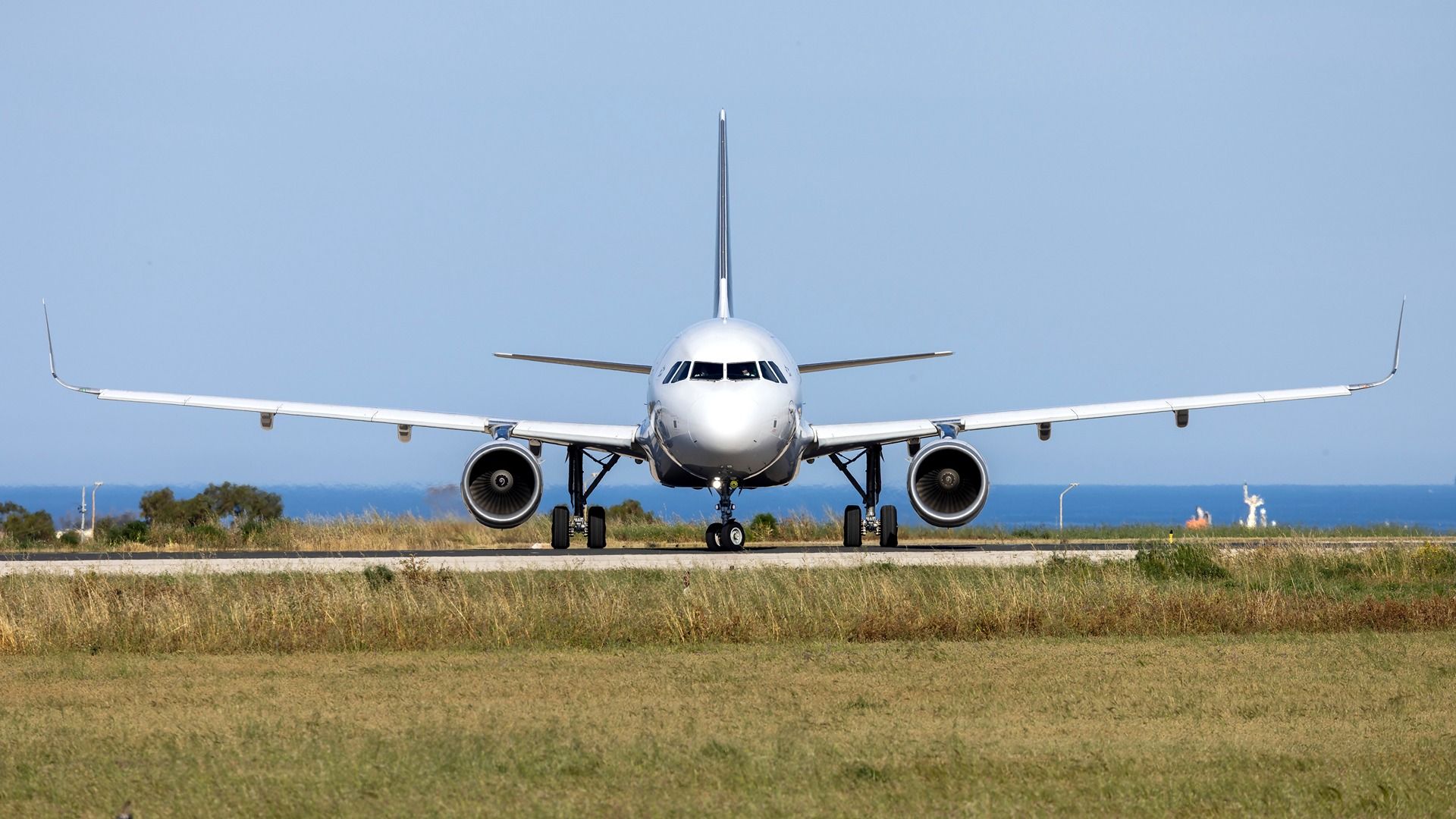 An Airbus A320-200 taxiing at an airport
