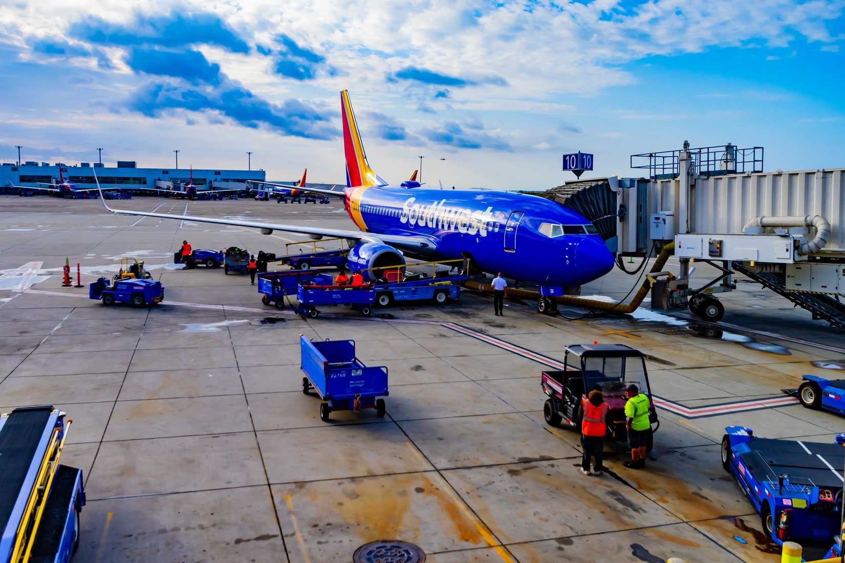 Southwest Airlines Unloading Luggage From A Boeing 737-700 at Oakland International Airport.