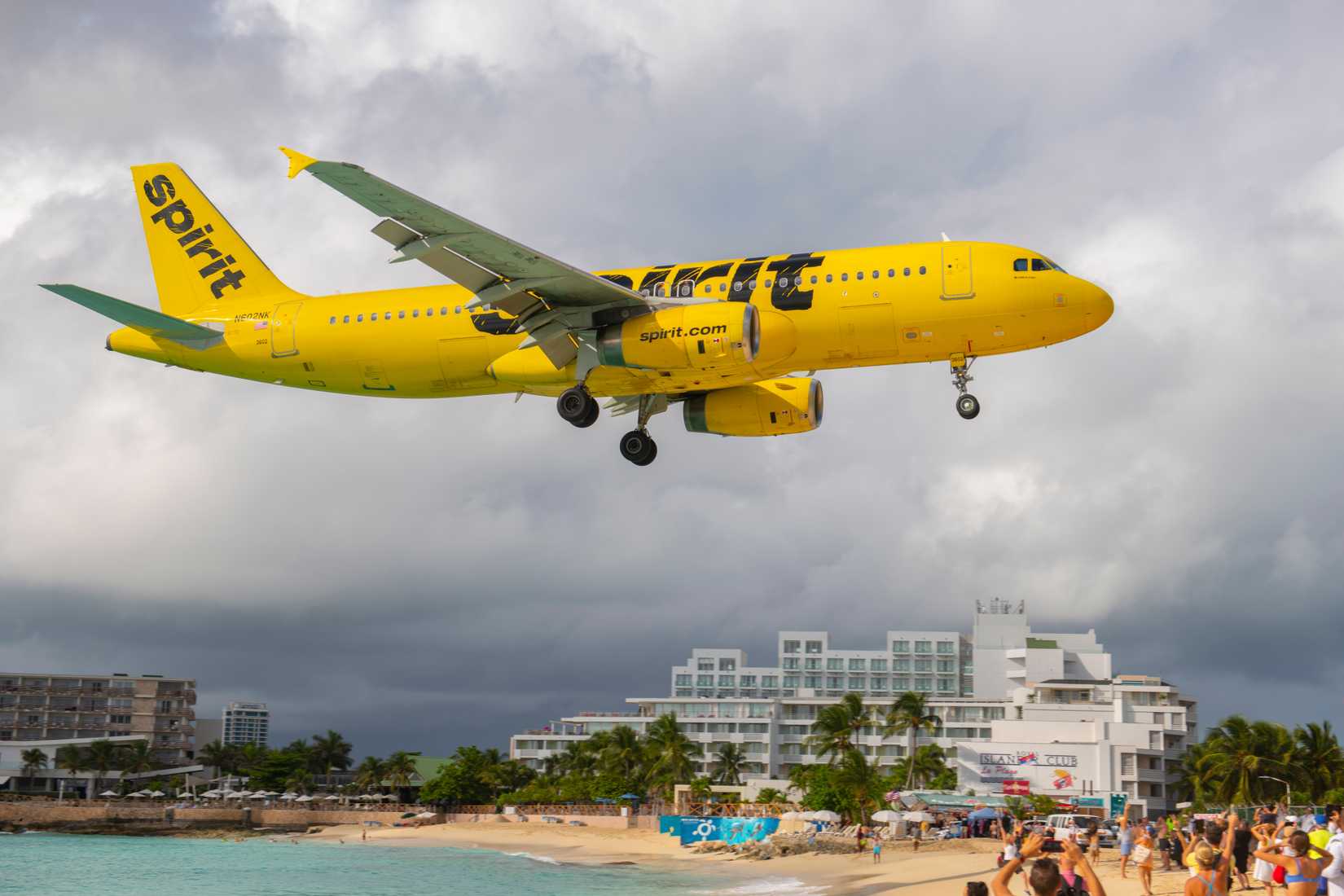 Spirit Airlines Airbus 320-200 N602NK flying over Maho Beach before landing on Princess Juliana International Airport SXM on Sint Maarten, Dutch Caribbean.