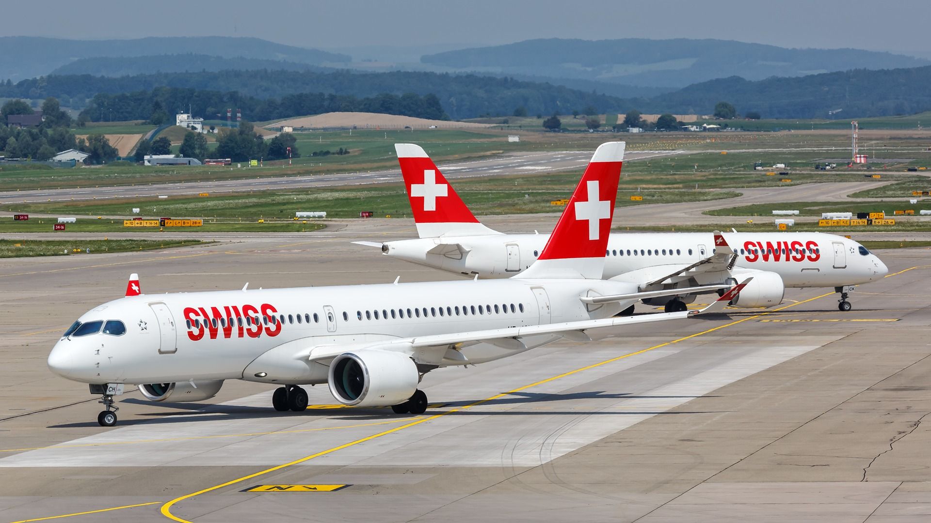 Swiss Airbus A220-300 airplanes at Zurich Airport (ZRH) in Switzerland.