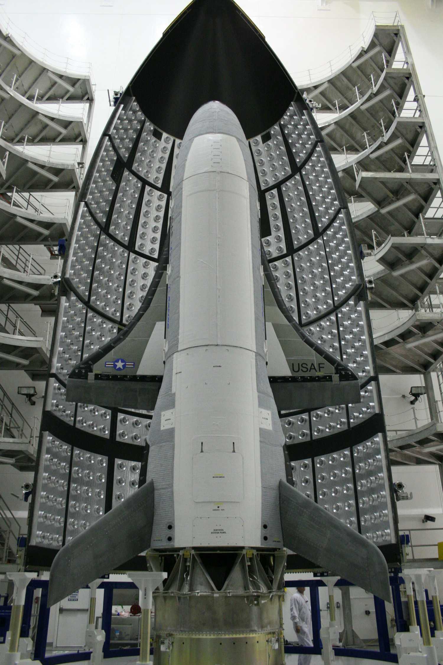The X-37B Orbital Test Vehicle waits in the encapsulation cell of the Evolved Expendable Launch vehicle April 5, 2010
