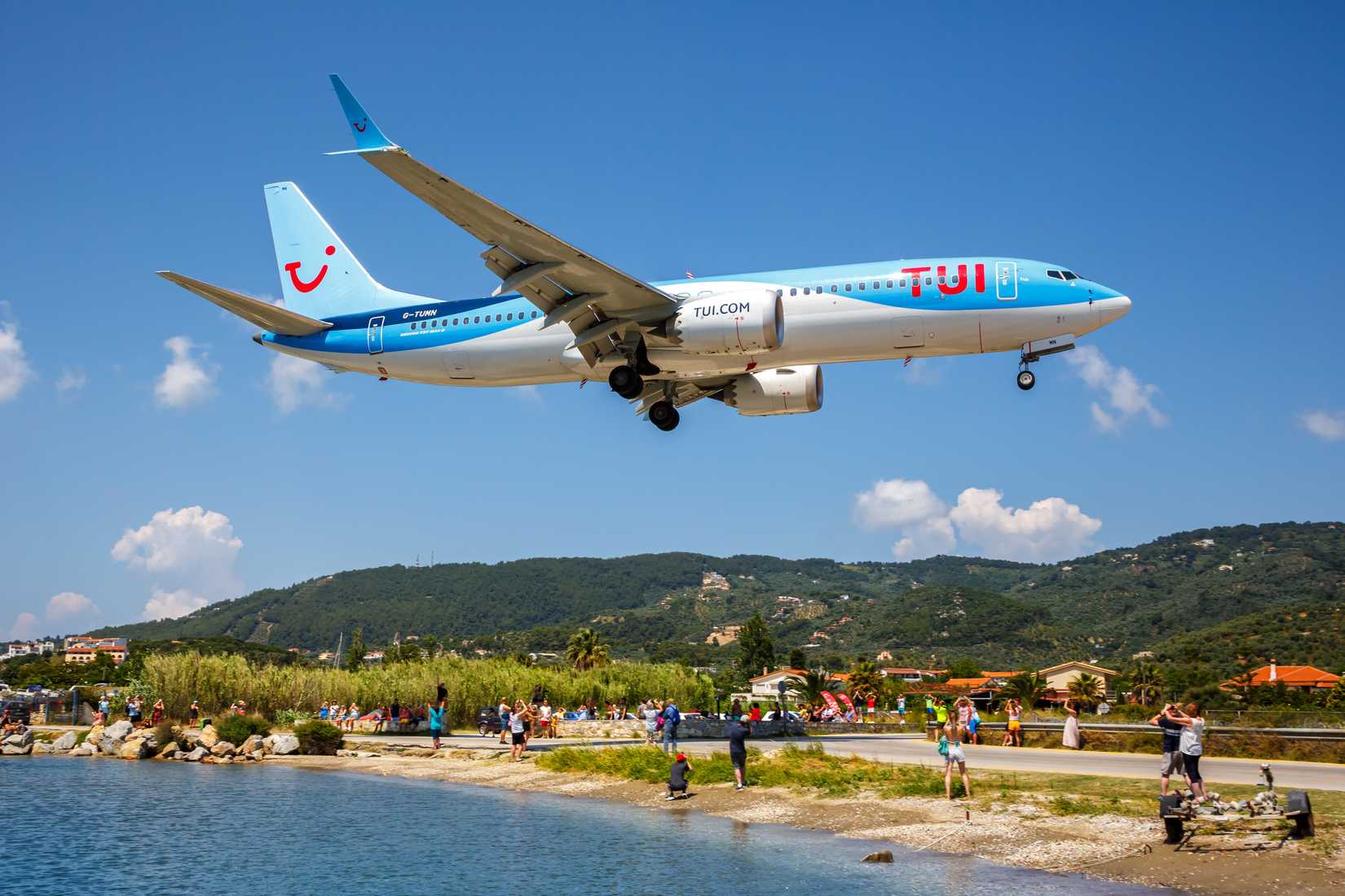 TUI Airways Boeing 737 MAX 8 airplane at Skiathos Airport (JSI) in Greece.