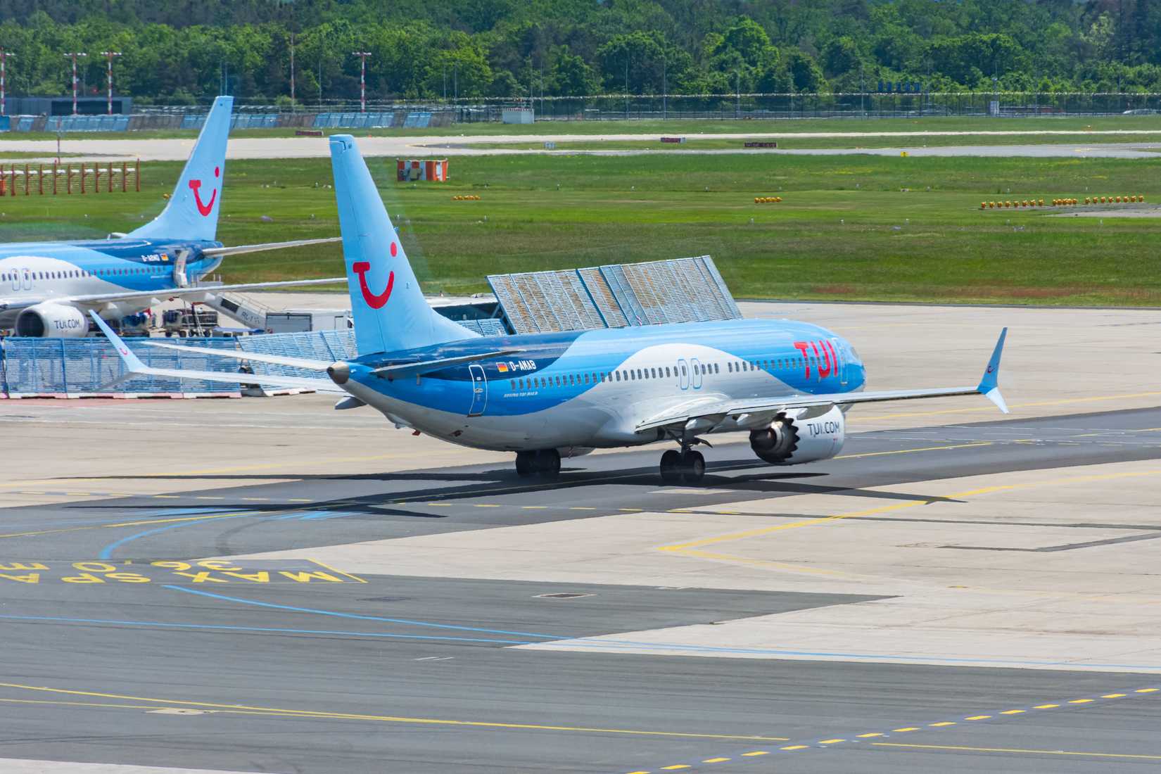 TUIfly Boeing 737 MAX 8 is heading towards runway for departure from Frankfurt International Airport.