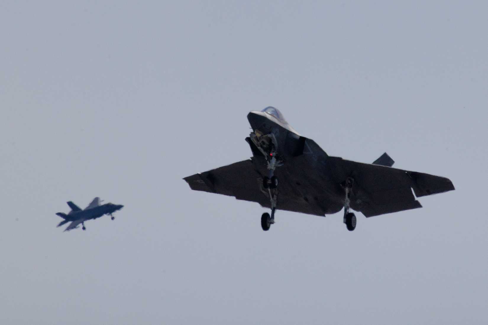 Two U.S. Navy F-35C Lightning II aircrafts with Strike Fighter Squadron (VFA) 147, Carrier Air Wing (CVW) 5, Carrier Strike Group 5