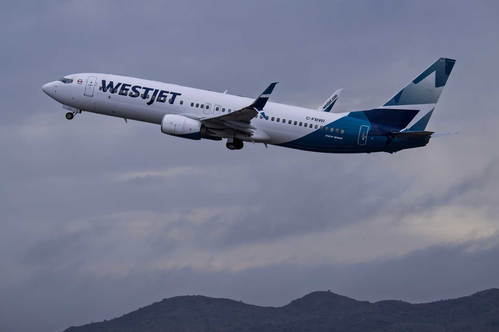 WestJet Airlines Boeing 737-800 C-FBWI departure.