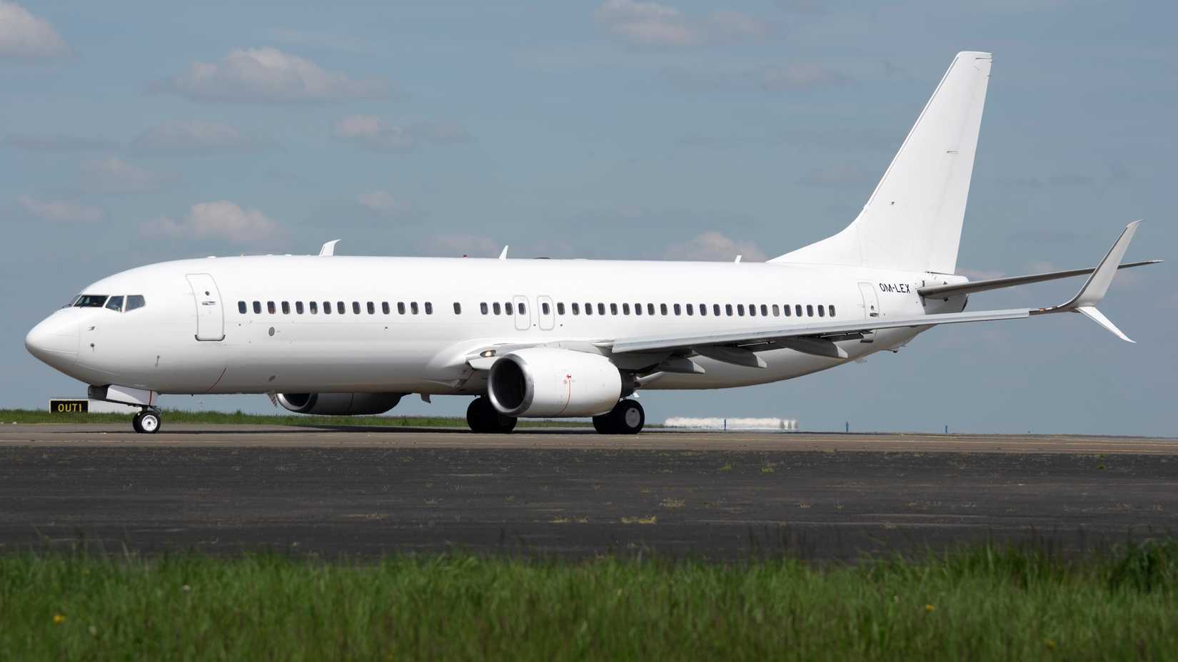 White boeing 737 OM-LEX taxing